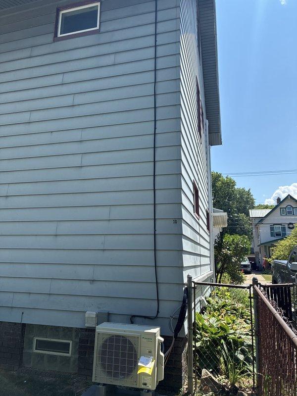 Completed installation of ductless mini-split HVAC system including electrical infrastructure setup. Installed sub panel and dedicated circuit to support the new system, mounted interior wall unit in conditioned space, and positioned Daikin outdoor condenser unit on exterior of residence. All electrical work, refrigerant lines, and system components were installed and commissioned on the same day for immediate operation.