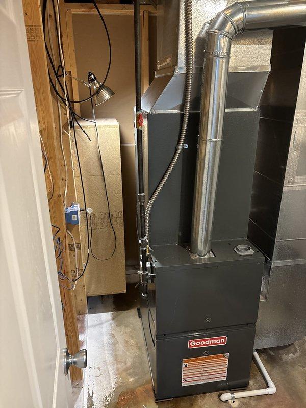 Completed full HVAC system installation in basement utility area, including new Goodman 80% efficiency furnace and air conditioning system. Installed furnace unit on concrete pad with proper clearances, connected metallic supply and return ductwork with professional-grade fittings and elbow transitions, and integrated flexible ducting where required. Routed all electrical connections to code, established proper condensate drainage system, and verified system operation and airflow throughout the home.
