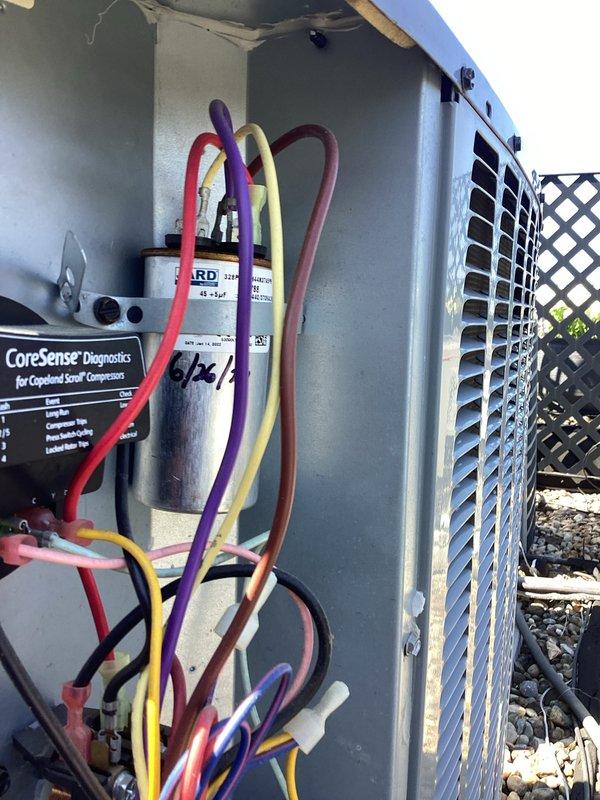 Completed comprehensive cooling system tune-up on residential HVAC unit. Performed diagnostic testing using digital multimeter to verify electrical readings and system performance, inspected compressor operation with CoreSense diagnostic tool, and checked refrigerant pressures with manifold gauges. All components operating within normal parameters, capacitor date verified, and system confirmed ready for continued service.