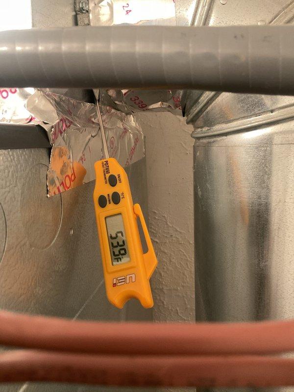 Completed routine cooling maintenance on residential air conditioning system. Inspected outdoor condenser unit, verified proper operation of compressor and fan motor, and confirmed supply air temperature at 53.9°F indicating adequate cooling performance. Cleared debris from around condenser unit, checked refrigerant lines and electrical connections, and tested system operation through full cooling cycle with all components functioning within normal parameters.