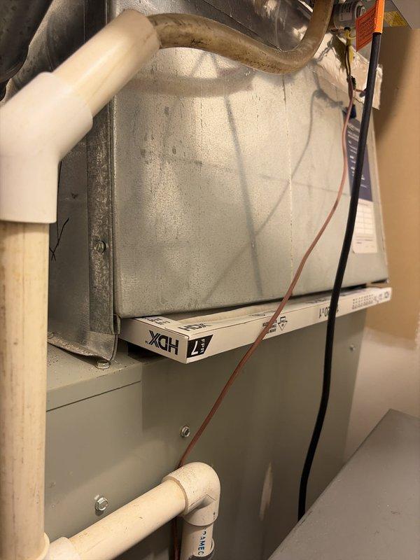 Completed comprehensive cooling system tune-up and inspection. During service, identified significant frost accumulation on air handler unit indicating possible airflow restriction or refrigerant issue. Measured condensate drainage system and verified proper operation of all mechanical components.