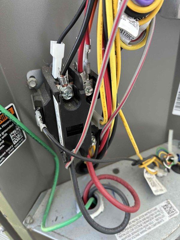 Completed routine HVAC cooling system maintenance inspection. Verified proper electrical connections at control panel terminal block and inspected all wiring for secure terminations and proper voltage routing. Examined ventilation grille and confirmed adequate airflow with clean, well-maintained components throughout the system.