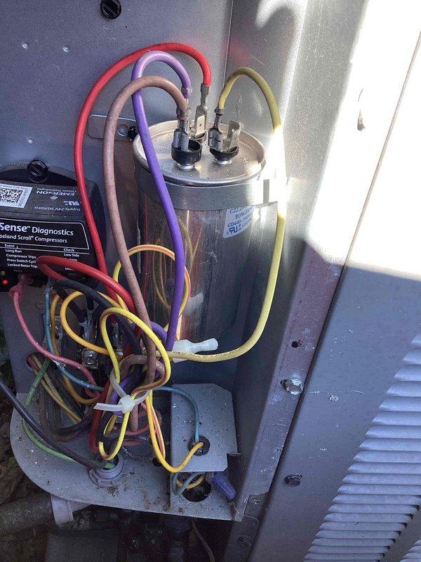 Completed routine cooling maintenance on aging HVAC system, including inspection of electrical components, capacitor connections, and refrigerant lines. Verified proper system operation with supply air temperature reading of 52.3°F and documented all electrical connections and diagnostic points for service records.