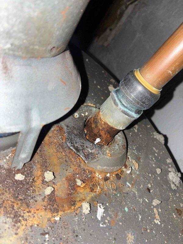 Completed cooling system tune-up and inspection. Upon arrival, observed significant rust and corrosion on water heater connections and HVAC cabinet panels, indicating potential moisture intrusion issues. Documented existing corrosion on metal fittings and cabinet surfaces for customer awareness and future monitoring.