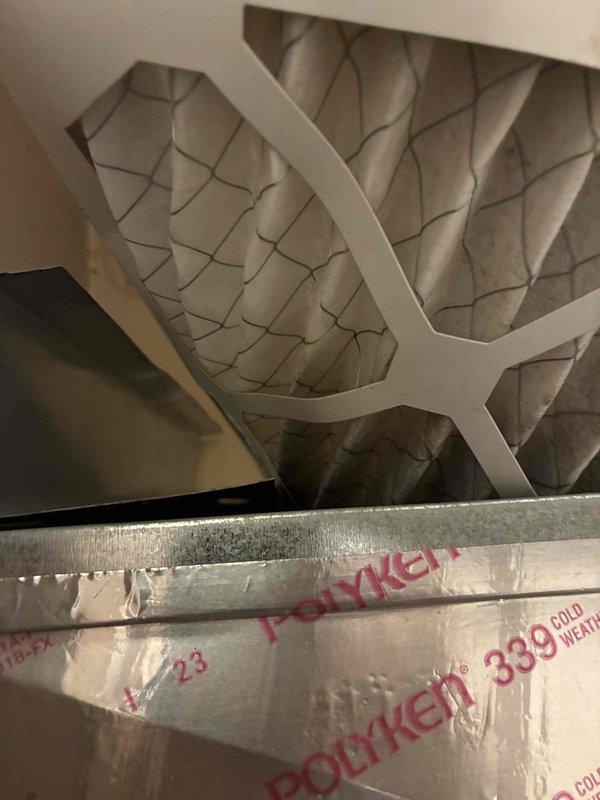 Completed preventive maintenance on wall-mounted HVAC cooling system, inspecting evaporator coil unit and ventilation components. Accessed interior service panel to verify equipment specifications and confirm proper installation of protected coil assembly with intact factory wrapping. All components operating within normal parameters upon completion of maintenance procedures.