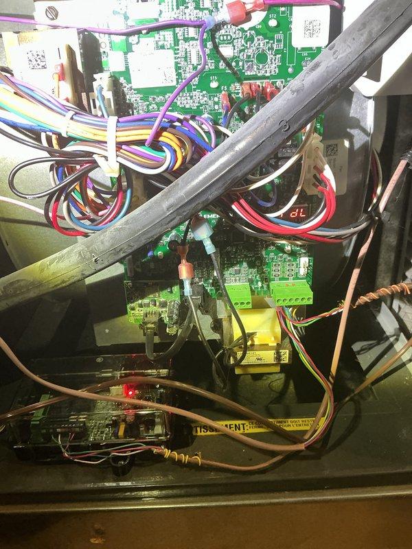 Responded to callback for AC unit that would not shut off after recent installation. Inspected thermostat settings and verified Honeywell Home ProSeries programmable thermostat was displaying 59°F with system in auto fan mode. Examined control board wiring and connections within equipment housing, confirming all wire terminations were secure and properly landed. Identified thermostat communication issue preventing proper cycle control. Corrected thermostat configuration settings and verified proper system operation with normal on/off cycling restored.