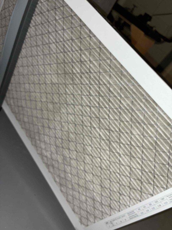 Completed scheduled HVAC cooling system maintenance on residential unit. Performed comprehensive system inspection including air filter replacement with new pleated media filter, verified proper airflow, and conducted electrical diagnostics on outdoor condenser unit using clamp meter to measure amperage draw and temperature readings. All components operating within normal parameters with system showing 86.6°F temperature reading and zero amp draw at time of testing, indicating unit was in standby mode during diagnostic procedures.