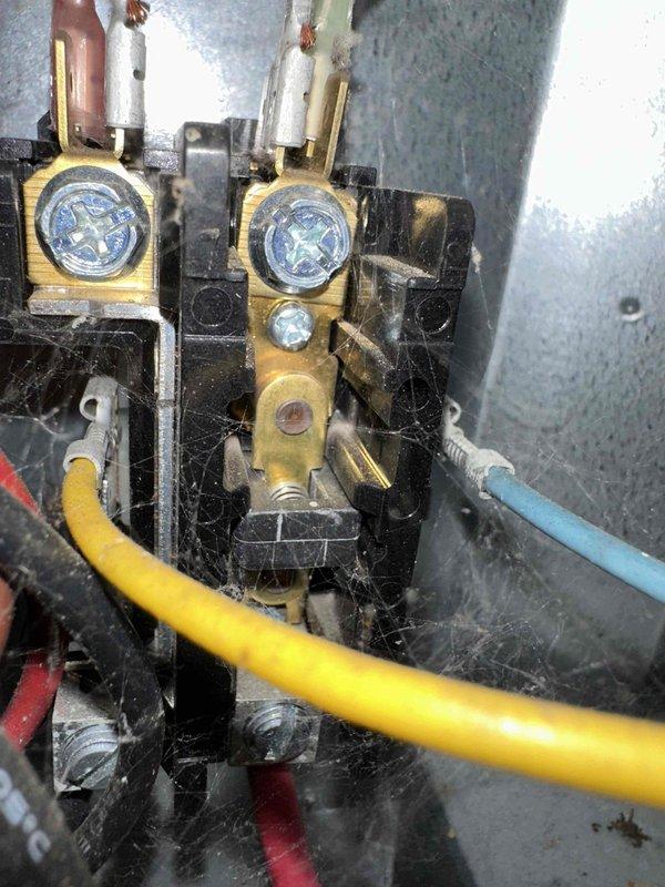 # HVAC Cooling Maintenance Completed

Performed comprehensive seasonal cooling maintenance on residential HVAC system. Conducted thorough inspection of furnace and air handler components with front access panel removed for complete system evaluation. Verified proper operation of gas valve assembly, checked all electrical connections at terminal blocks, and inspected control board wiring integrity. Examined blower motor assembly, capacitor, and associated electrical components for wear and proper function. All wire connections at brass terminals were inspected and found secure with no signs of overheating or degradation. System components photographed and documented showing normal operating condition with no immediate service needs identified.