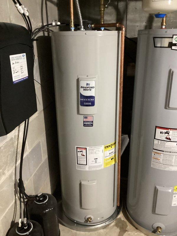 Replaced existing water heater with new 50-gallon tall Bradford White electric water heating unit including installation of drain pan for secondary protection. Connected copper supply lines, flexible conduits, and all electrical connections per manufacturer specifications and local code requirements.