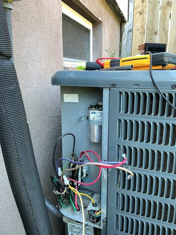 Responded to no cooling complaint on residential air conditioning system. Upon arrival, performed diagnostic evaluation of outdoor condensing unit. Opened access panel to inspect electrical components and test capacitor functionality using digital multimeter. Capacitor showed signs of failure with multiple wire connections requiring attention. Provided customer education regarding blower wheel maintenance and its impact on system performance, including information on common causes of contamination, potential secondary repairs, and benefits of regular cleaning for system efficiency and indoor air quality.