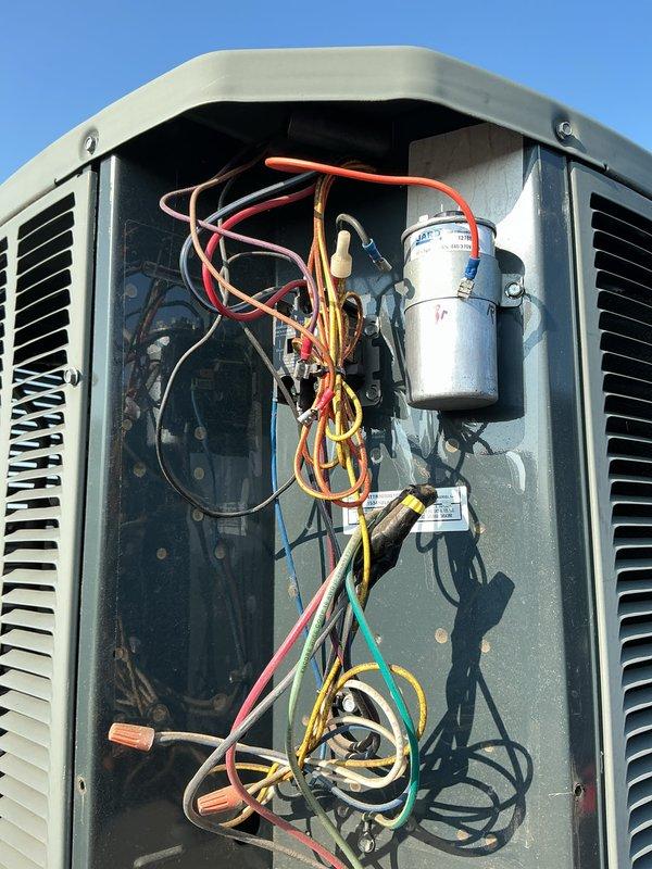 Completed comprehensive cooling maintenance on aging HVAC system, including inspection and testing of outdoor condensing unit's electrical components, capacitor verification, and indoor furnace control board diagnostics. Documented system condition with detailed photos showing wiring configurations and component status for future service reference.