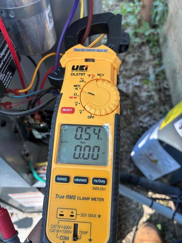 # HVAC Cooling Maintenance Completed

Performed comprehensive cooling system maintenance on residential HVAC unit. Conducted electrical diagnostics using digital clamp meter to verify proper amperage draw and voltage levels across system components. Measured current flow on compressor circuit, confirming readings within manufacturer specifications at 0.54 amps on control circuit. Inspected and tested low-voltage control wiring, including thermostat connections with multiple conductor bundle showing proper color coding and secure terminations. Verified electrical panel connections and control board functionality. All voltage readings confirmed within acceptable CAT IV 600V parameters. System tested and operating normally with proper electrical values throughout cooling cycle.