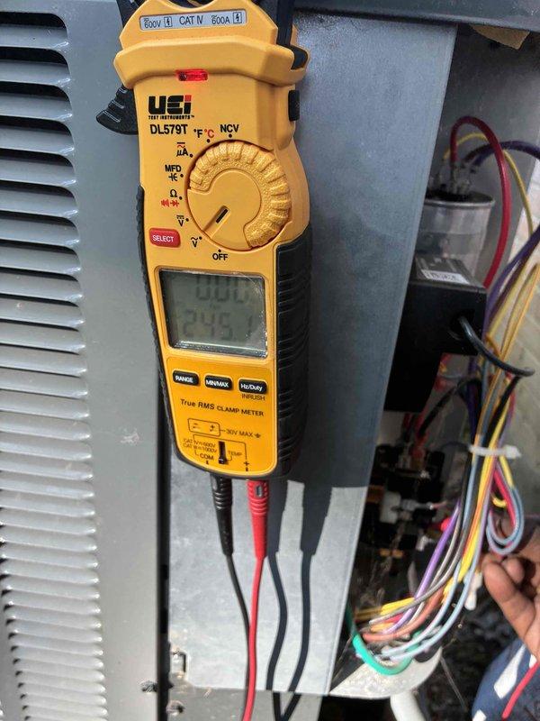 # HVAC Cooling Maintenance Completed

Performed comprehensive cooling system maintenance on residential HVAC unit. Conducted electrical diagnostics using digital clamp meter to verify proper amperage draw and voltage levels across system components. Measured current flow on compressor circuit, confirming readings within manufacturer specifications at 0.54 amps on control circuit. Inspected and tested low-voltage control wiring, including thermostat connections with multiple conductor bundle showing proper color coding and secure terminations. Verified electrical panel connections and control board functionality. All voltage readings confirmed within acceptable CAT IV 600V parameters. System tested and operating normally with proper electrical values throughout cooling cycle.