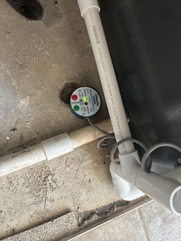 Removed and replaced prohibited saddle valve on humidifier water supply line with approved ball valve connection. Installed safety switch in mechanical area between water heater and furnace to meet code requirements and ensure proper system shutdown protection.