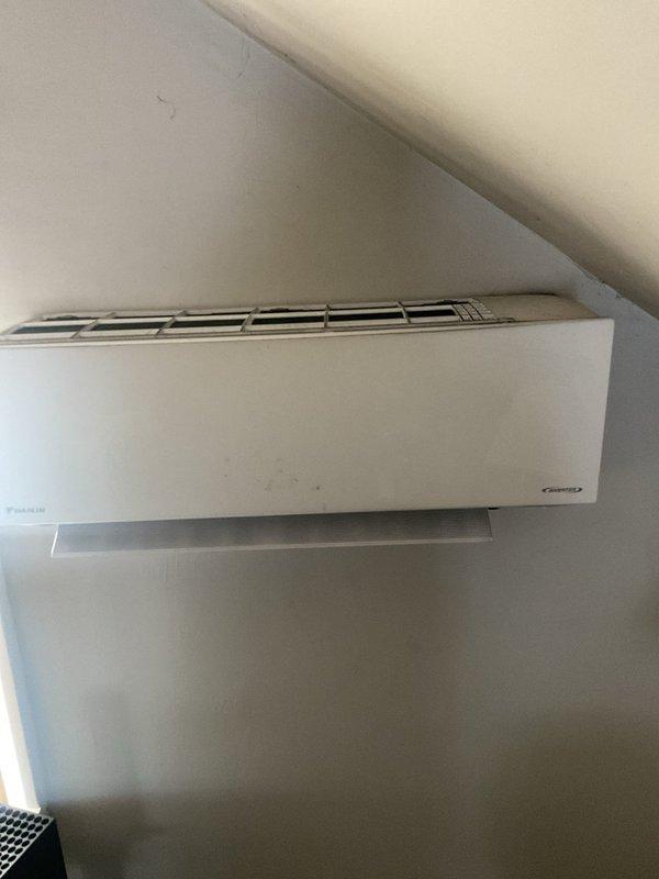 Completed scheduled maintenance on a Daikin ductless mini-split cooling system. Accessed and inspected air filters, which showed normal dust accumulation from regular operation. Verified proper mounting and operation of the wall-mounted indoor unit, confirming system functionality and readiness for continued cooling performance.