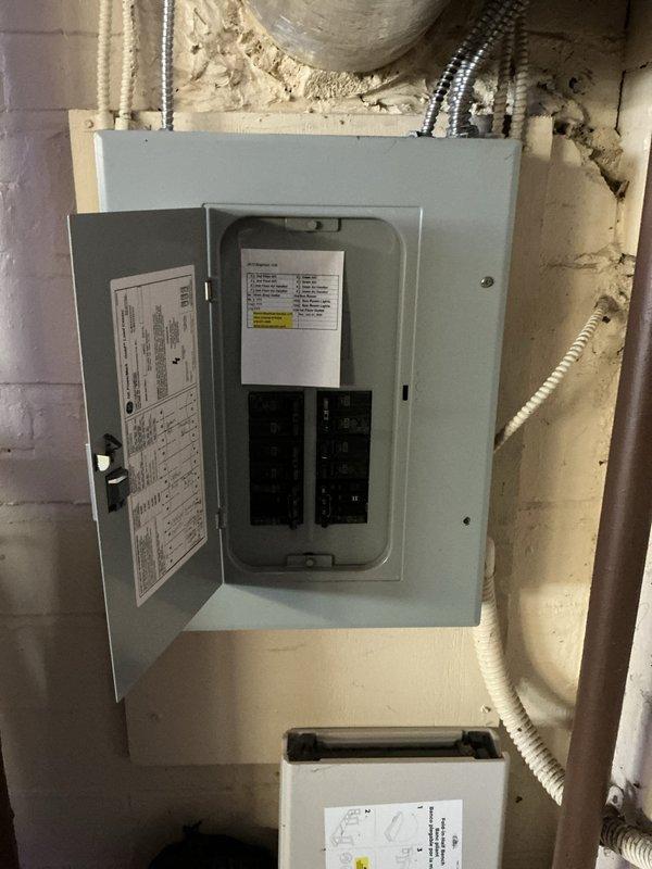 Conducted site assessment for Unico high-velocity HVAC system replacement, evaluating existing electrical infrastructure and reviewing second-floor layout to determine equipment placement and ductwork routing options. Documented electrical panel capacity and configuration, analyzed floor plan showing 1,155 sq ft across primary bedroom, additional bedroom, bathrooms, laundry room, and hallway spaces to develop comprehensive replacement proposal with multiple system configuration options.
