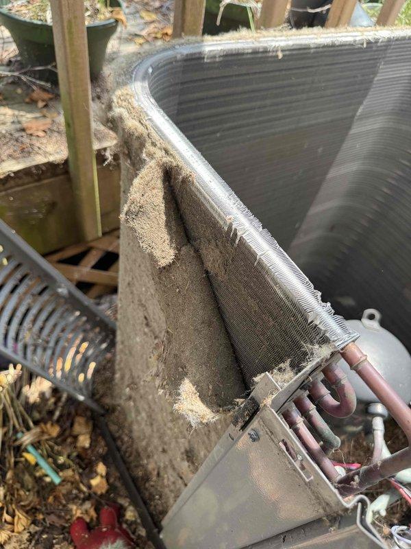 Responded to no cooling complaint with indoor temperature reading 84°F while thermostat set to 72°F. Upon inspection, found outdoor condenser unit with heavily soiled condenser coil covered in thick accumulation of dirt, dust, pollen, and environmental debris, significantly restricting airflow and reducing heat transfer efficiency. Performed thorough coil cleaning to remove buildup from fins and restored proper airflow through condenser. System tested and confirmed return to normal cooling operation.
