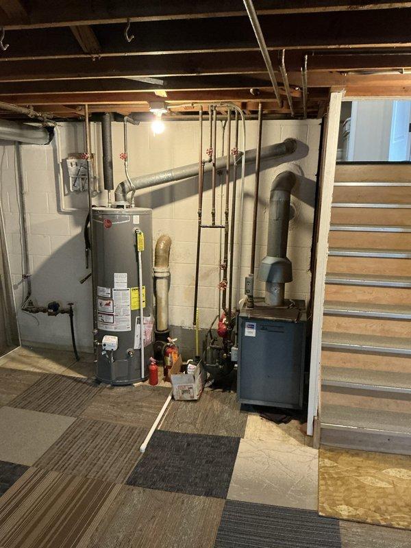 Performed comprehensive inspection of 20-year-old boiler system located in basement for new homeowner with unknown service history. Evaluated overall unit condition, assessed remaining lifespan, and documented existing equipment configuration including associated plumbing connections and heating distribution system. Provided detailed replacement quote and recommendations based on current system age and operational status.