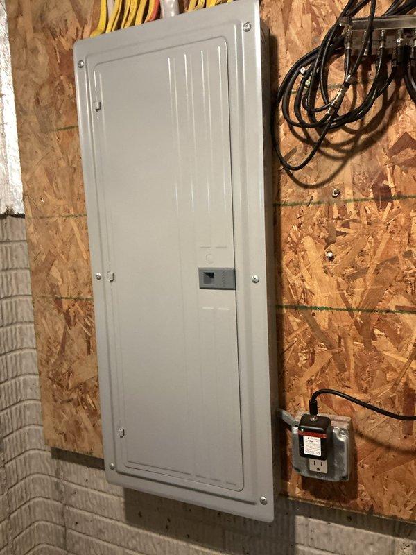 Conducted comprehensive electrical inspection of residential mechanical and electrical systems. Examined HVAC equipment connections and verified proper installation of main electrical panel and associated disconnect switches in utility area. Documented existing wiring configurations, panel mounting, and equipment grounding for compliance verification.