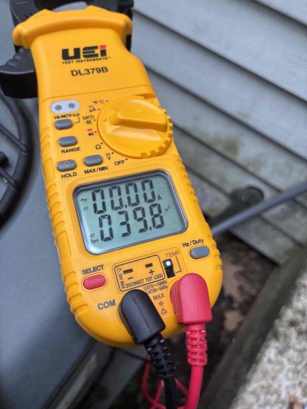 Completed comprehensive cooling system tune-up including inspection of air filter which showed moderate dust accumulation from normal operation. Performed electrical diagnostics and measurements on outdoor unit components to verify proper system operation and performance parameters within manufacturer specifications.