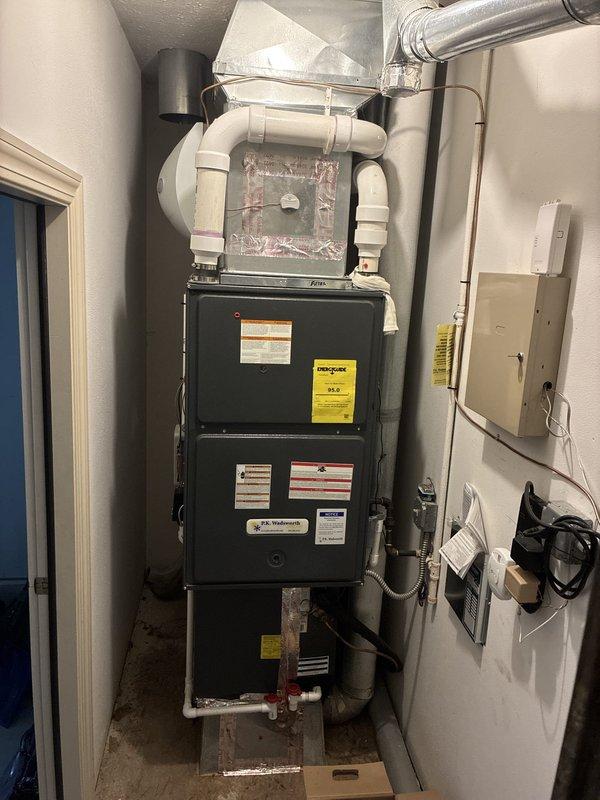 Provided comprehensive quote for complete HVAC system replacement at residential property. Evaluated existing dark green furnace unit with associated PVC ventilation ductwork and flexible metallic ducting, along with current Honeywell programmable thermostat showing system operating in cooling mode at 75°F setpoint. Documented existing equipment configuration, electrical connections, gas line setup with shut-off valve, and overall mechanical room layout to prepare detailed replacement estimate for modernized heating and cooling system.