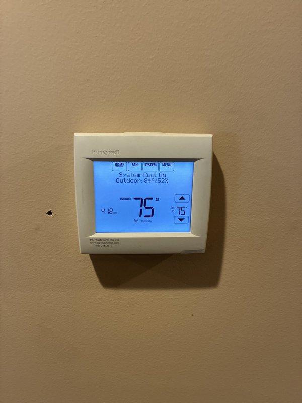 Provided comprehensive quote for complete HVAC system replacement at residential property. Evaluated existing dark green furnace unit with associated PVC ventilation ductwork and flexible metallic ducting, along with current Honeywell programmable thermostat showing system operating in cooling mode at 75°F setpoint. Documented existing equipment configuration, electrical connections, gas line setup with shut-off valve, and overall mechanical room layout to prepare detailed replacement estimate for modernized heating and cooling system.
