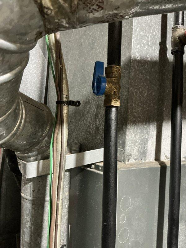 Conducted comprehensive site assessment for complete HVAC system replacement involving 20-year-old Rheem furnace located in basement and 3-ton air conditioning unit positioned outside. Evaluated existing equipment condition, documented current installation configuration including refrigerant lines, ductwork connections, electrical service, and gas piping. Inspected basement mechanical room infrastructure noting copper refrigerant lines with brass fittings, insulated supply ductwork with moisture accumulation, and existing utility connections. Assessed outdoor AC unit placement and clearances. Measured existing system specifications to provide accurate equipment sizing recommendations for American Standard replacement units. Photographed current installation details including piping configurations, duct routing, and mechanical room layout to facilitate precise equipment matching and installation planning. Verified electrical service capacity, gas line sizing, condensate drainage provisi