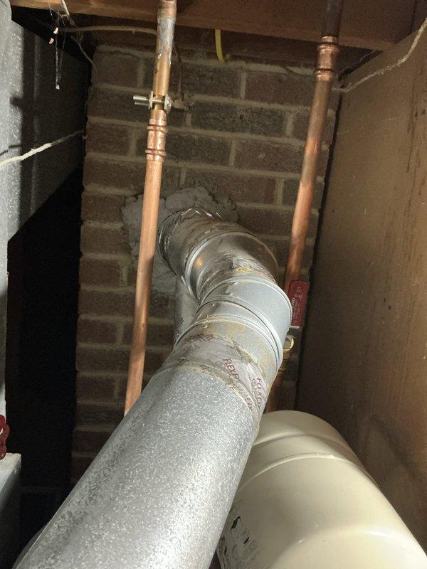 Conducted comprehensive site assessment for complete HVAC system replacement involving 20-year-old Rheem furnace located in basement and 3-ton air conditioning unit positioned outside. Evaluated existing equipment condition, documented current installation configuration including refrigerant lines, ductwork connections, electrical service, and gas piping. Inspected basement mechanical room infrastructure noting copper refrigerant lines with brass fittings, insulated supply ductwork with moisture accumulation, and existing utility connections. Assessed outdoor AC unit placement and clearances. Measured existing system specifications to provide accurate equipment sizing recommendations for American Standard replacement units. Photographed current installation details including piping configurations, duct routing, and mechanical room layout to facilitate precise equipment matching and installation planning. Verified electrical service capacity, gas line sizing, condensate drainage provisi