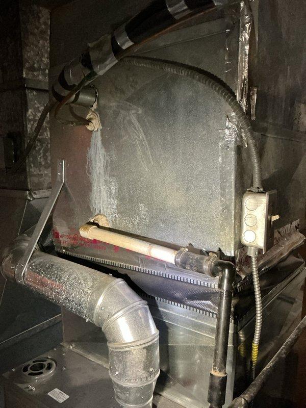 Responded to service call for non-operational air conditioning system on 15-year-old residential unit. Upon arrival, performed diagnostic evaluation of complete HVAC system including furnace/air handler assembly and outdoor condensing unit. Conducted visual inspection of indoor equipment, verifying electrical connections, control panel functionality, and ductwork integrity. Examined refrigerant line insulation, condensate drainage components, and furnace blower assembly for proper operation. Documented equipment condition through photographic records showing air handler installation, ductwork connections, and associated mechanical components in utility space. System evaluation completed to determine cause of cooling failure and provide recommendations for repair or replacement options based on age and condition of existing equipment.