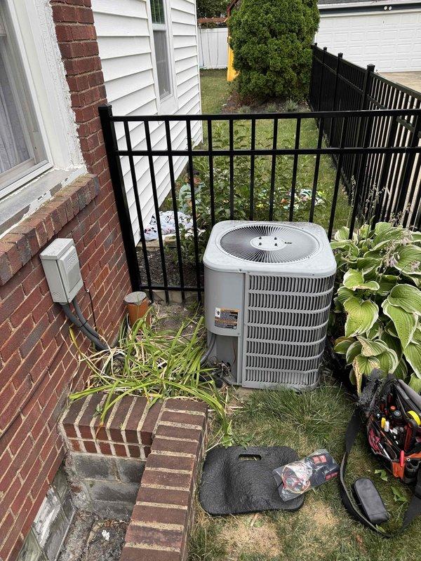 Responded to no-cooling call following reported brownout event. Upon arrival, confirmed thermostat was clicking but outdoor condensing unit failed to start. Performed electrical diagnostics using digital multimeter at outdoor unit terminal connections. Measured voltage at contactor and control circuits to identify power supply issues related to electrical surge damage. Testing revealed compromised electrical components preventing compressor and condenser fan operation. Documented equipment condition and electrical readings with photos showing wiring connections and voltage measurements at terminal block.