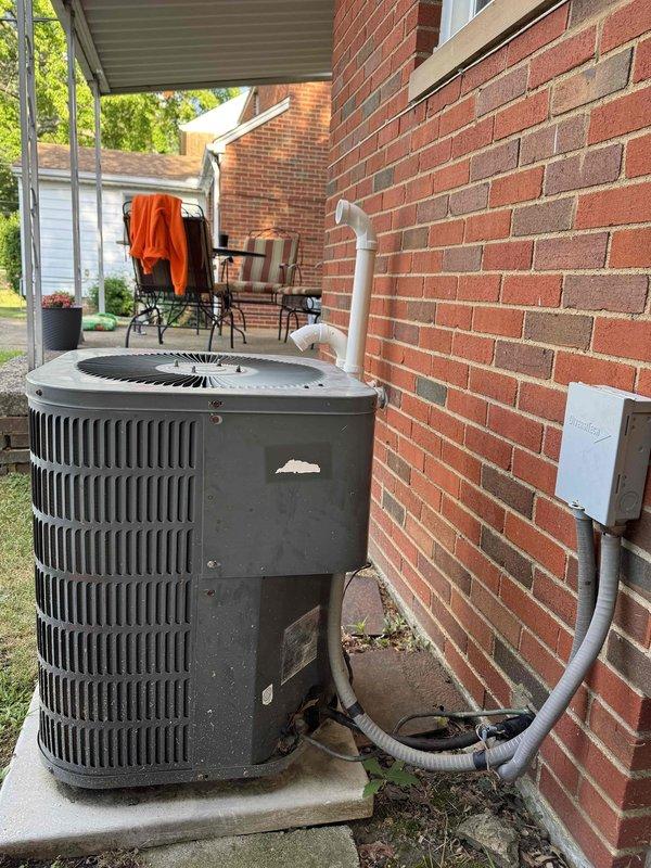 Completed scheduled preventative maintenance on residential split-system air conditioning unit. Performed comprehensive inspection of outdoor condenser unit, verified proper operation of compressor and condenser fan motor, checked electrical connections and disconnect box for secure termination, and inspected refrigerant line insulation and penetration seals. Unit found operating within normal parameters with no deficiencies noted at time of service.