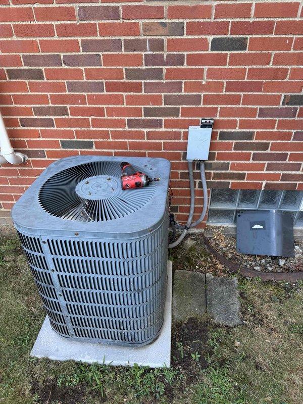 Completed scheduled preventative maintenance on residential split-system air conditioning unit. Performed comprehensive inspection of outdoor condenser unit, verified proper operation of compressor and condenser fan motor, checked electrical connections and disconnect box for secure termination, and inspected refrigerant line insulation and penetration seals. Unit found operating within normal parameters with no deficiencies noted at time of service.