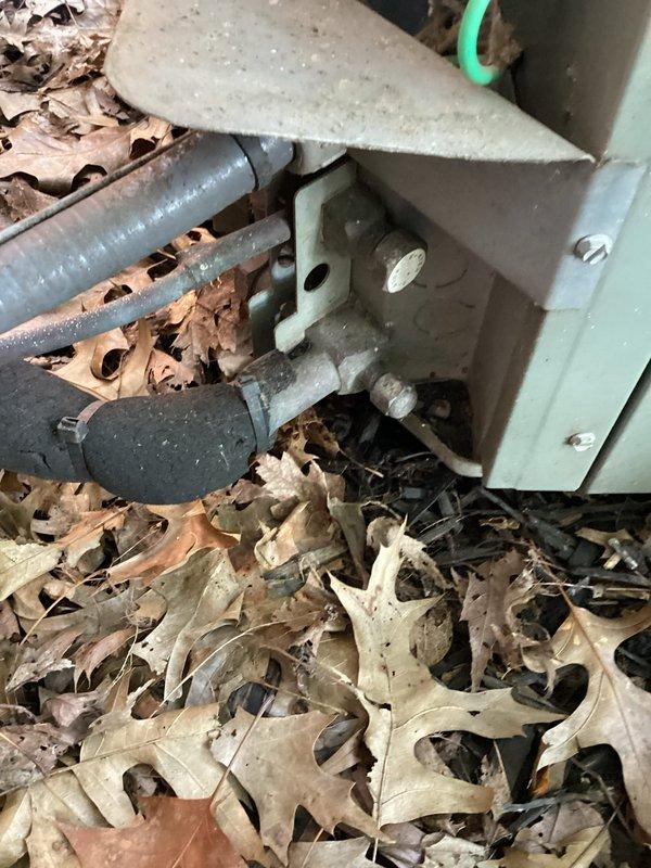 Completed scheduled preventive maintenance on residential air conditioning system. Performed comprehensive system inspection including electrical testing with digital multimeter, verifying proper voltage and amperage readings within manufacturer specifications. Cleared debris accumulation around outdoor condensing unit base, including removal of leaves and organic matter from around refrigerant line penetrations and equipment cabinet. Inspected conduit connections and refrigerant lines for signs of wear or damage. All system components found operating normally with no immediate service needs identified. Unit left in proper working condition.