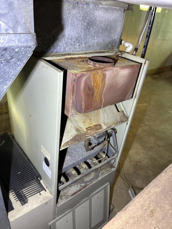 Conducted full system replacement estimate for residential HVAC unit. Inspection revealed severely corroded heat exchanger with extensive rust throughout upper chamber and burner assembly, indicating prolonged moisture exposure and potential safety concerns. Documented internal component condition and provided homeowner with comprehensive replacement options for complete system upgrade.
