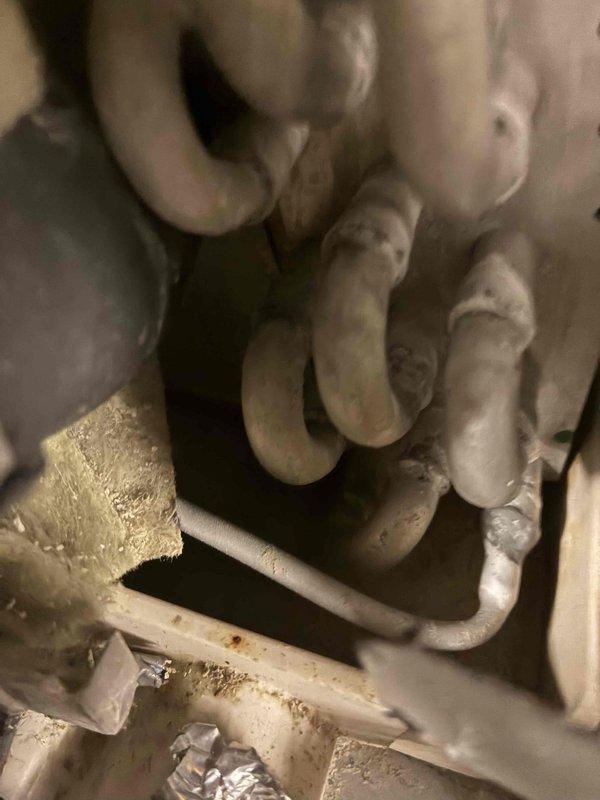 Responded to no-cooling call on 2-year-old residential air conditioning system covered under service contract. Upon arrival, performed diagnostic assessment of outdoor condensing unit and indoor evaporator coil assembly. Inspected refrigerant lines, electrical connections, and condensate drainage system. Verified proper operation of condenser fan motor and compressor. Checked refrigerant charge levels and system pressures. Examined evaporator coil for restrictions or debris accumulation. Tested thermostat communication and control board functionality. System restored to normal cooling operation. All components operating within manufacturer specifications at time of departure.
