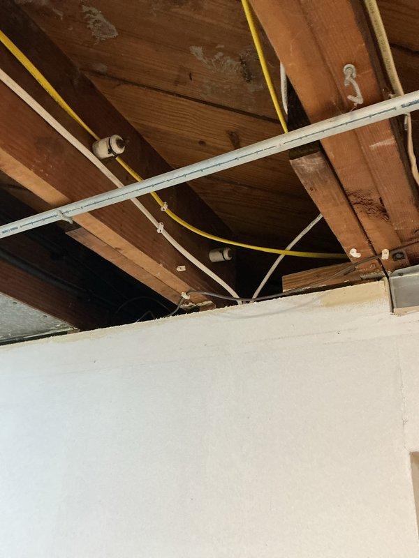 Responded to emergency no-cooling call on 3-year-old system. Located severed low-voltage wire in attic space between HVAC equipment and thermostat. Repaired damaged wire connection, restored power to system, and verified proper operation of Aprilaire humidifier control and cooling function.