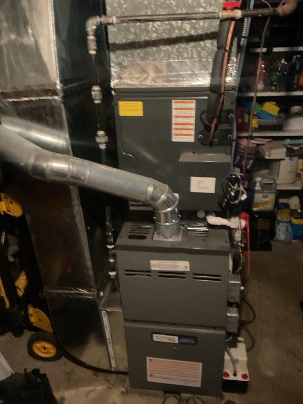 Completed preventive maintenance on residential split system HVAC cooling equipment. Inspected indoor furnace unit with integrated evaporator coil in basement mechanical room, verifying proper ductwork connections, refrigerant line routing, and electrical connections. Evaluated outdoor Amana condensing unit positioned on concrete pad, confirming unit operational status and exterior condition. All components inspected and found to be in proper working order with no visible deficiencies or required repairs at time of service.