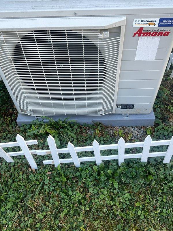 Completed preventive maintenance on residential split system HVAC cooling equipment. Inspected indoor furnace unit with integrated evaporator coil in basement mechanical room, verifying proper ductwork connections, refrigerant line routing, and electrical connections. Evaluated outdoor Amana condensing unit positioned on concrete pad, confirming unit operational status and exterior condition. All components inspected and found to be in proper working order with no visible deficiencies or required repairs at time of service.