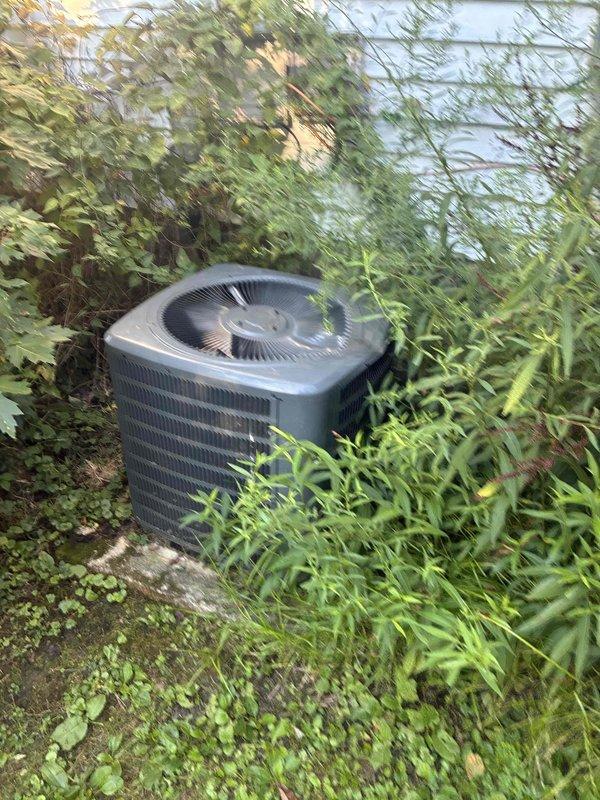 Completed routine cooling system maintenance visit on residential air conditioning system. Serviced outdoor condenser unit which was found surrounded by overgrown vegetation and debris; cleared area around unit to restore proper airflow and prevent potential efficiency issues. Inspected and replaced dirty 20x25x1 air filter showing significant dust and debris accumulation, restoring proper system airflow and indoor air quality.