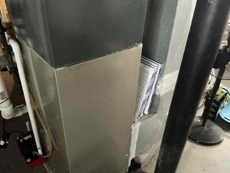 Conducted residential HVAC estimate for furnace replacement at property with existing Bryant brand unit installed in basement mechanical room. Documented current system configuration including ductwork connections, electrical components, and associated air handler equipment. Photographed existing installation to provide homeowner with replacement options and system upgrade recommendations.