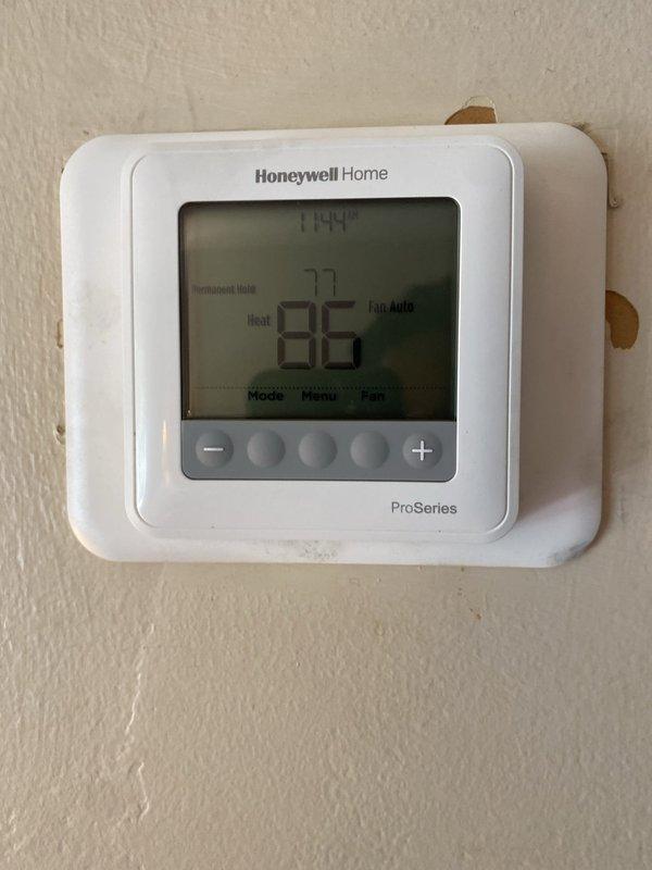 Completed furnace installation with 80% efficiency unit requiring 90-degree rotation for proper positioning. Extended gas line and replaced flue pipe to accommodate new configuration. Installed and programmed Honeywell Home ProSeries thermostat, verified system operation and proper heating function upon completion.