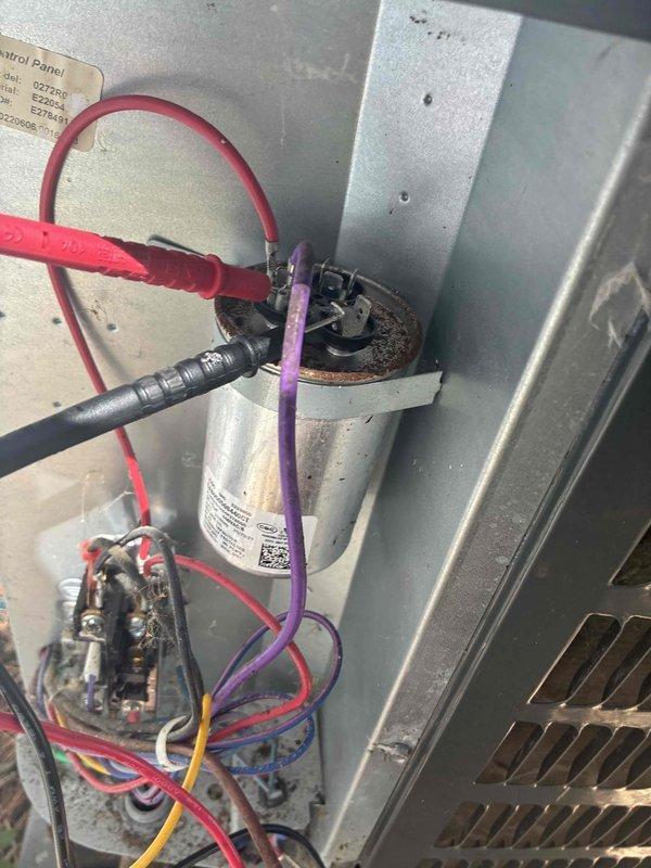 Completed scheduled preventive maintenance on residential air conditioning system. Performed comprehensive inspection of electrical components including capacitor, contactor, and associated wiring connections. Verified proper electrical readings using digital clamp meter, confirming system operating within normal parameters at 0.00 amp draw during testing phase. All electrical connections secure, capacitor functioning properly, and unit ready for continued cooling operation.