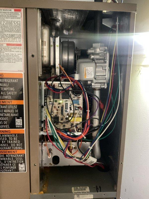 Performed comprehensive cooling maintenance on Magic Pack HVAC system located in first garage. Accessed unit with ladder, inspected control panel components including motor, blower assembly, and electrical connections, verified all wiring and circuit board functionality, and examined evaporator coil and refrigerant lines for proper operation. All system components found operating within normal parameters and unit returned to service.