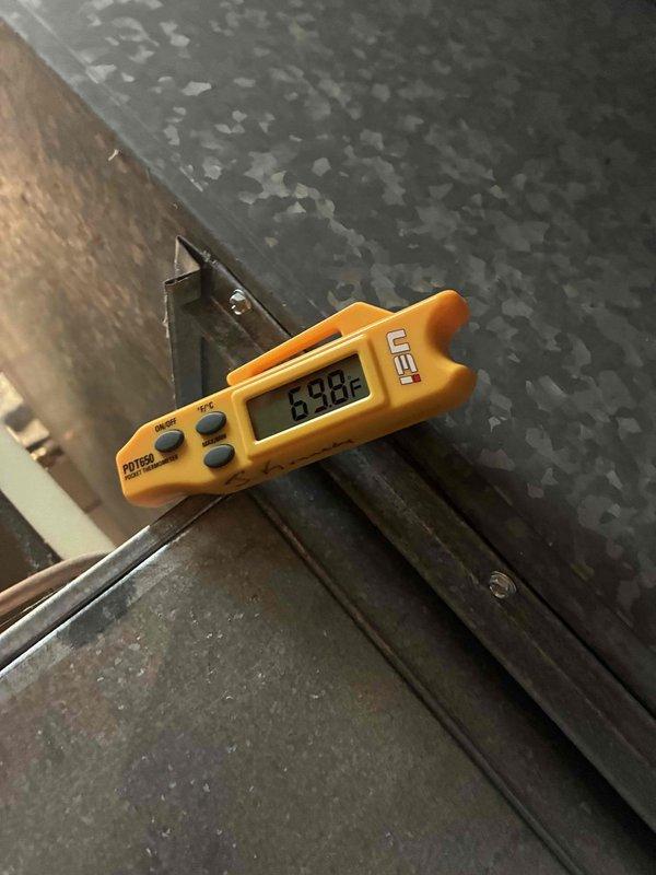 Completed routine cooling maintenance on HVAC system. Performed temperature diagnostics using digital measuring equipment, recording supply air temperature of 83.8°F at the unit. Inspected and verified proper operation of all electrical components including control board terminals, run capacitor, and associated wiring connections. All components found to be in normal working condition with no deficiencies noted.
