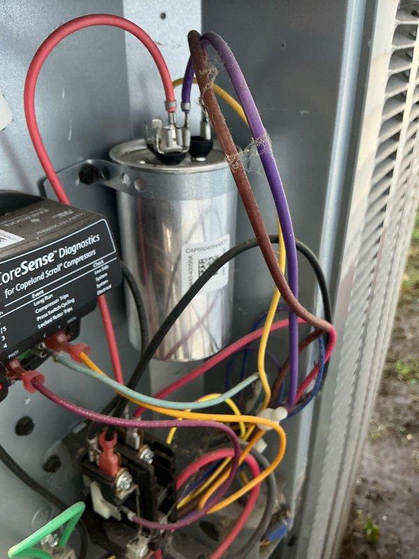 Responded to air conditioning unit leaking water into basement. Upon inspection, found condensate drainage system with safety float switch installed on P-trap assembly. Verified proper operation of condensate pump and drainage lines. Inspected outdoor condensing unit components including capacitor, compressor diagnostics module, and electrical connections. System tested and confirmed operational with no active leaks observed during runtime.