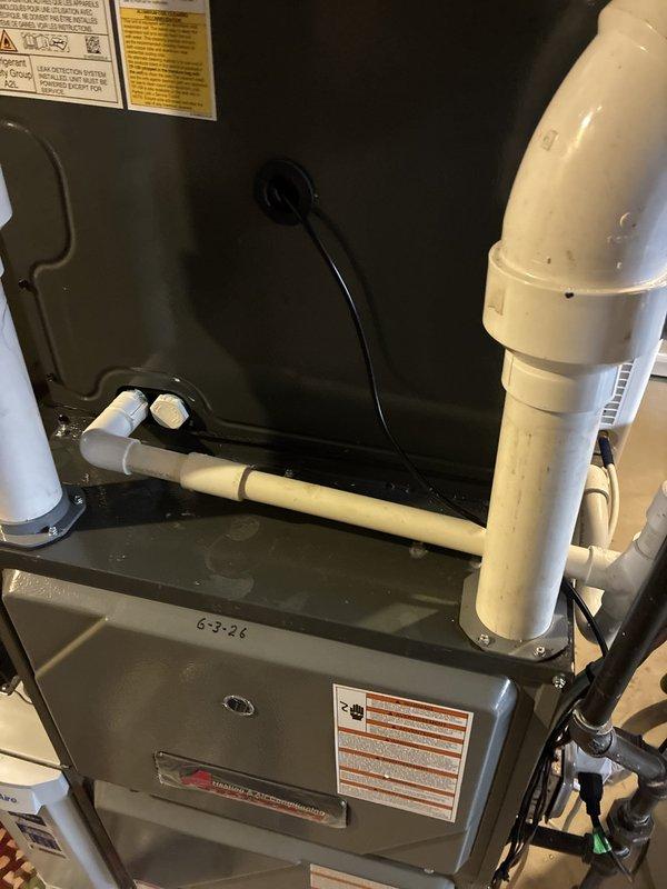 Completed warranty inspection and correction of HVAC installation deficiencies. Identified improper condensate drain line configuration with excessive run length, incorrectly installed P-trap, and wiring errors. Completely reinstalled condensate drainage system to manufacturer specifications, corrected all wiring connections, and properly configured P-trap to ensure adequate drainage and system protection.