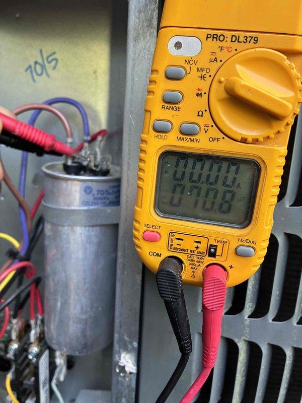 Completed preventive maintenance on residential HVAC cooling system. Performed comprehensive inspection of furnace unit, verified proper operation of all electrical components, and tested capacitor functionality using digital multimeter to ensure optimal system performance. Cleaned condensate drain lines and confirmed all safety controls, gas connections, and ductwork connections were secure and operating within manufacturer specifications.