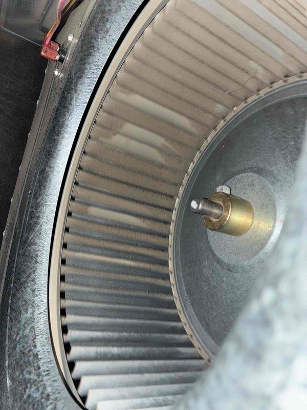 Completed routine preventative maintenance on residential air conditioning system. Inspected and serviced indoor blower assembly, including squirrel cage fan wheel and motor shaft components, noting normal dust accumulation. Examined outdoor condensing unit electrical components, verifying proper operation of capacitor, contactor, and associated wiring connections.