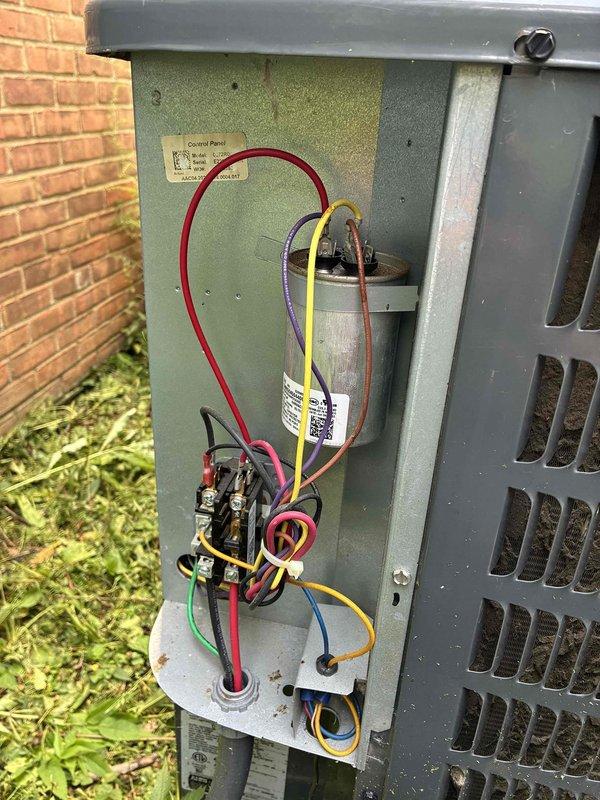 Completed routine preventative maintenance on residential air conditioning system. Inspected and serviced indoor blower assembly, including squirrel cage fan wheel and motor shaft components, noting normal dust accumulation. Examined outdoor condensing unit electrical components, verifying proper operation of capacitor, contactor, and associated wiring connections.