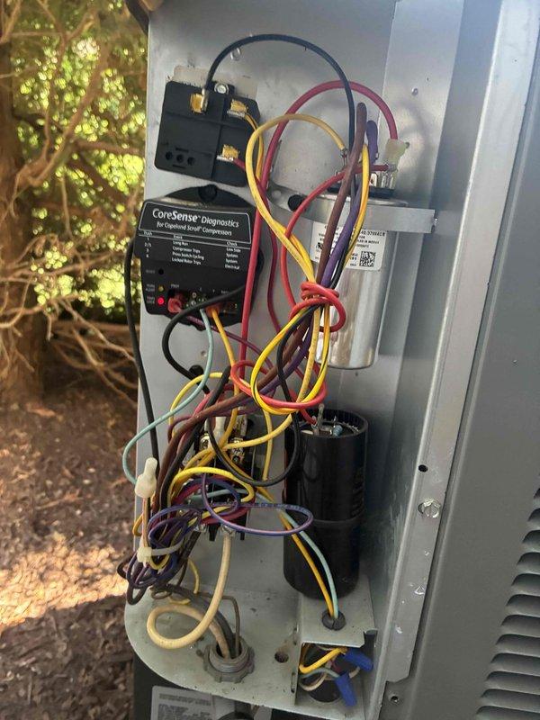 Completed scheduled preventive maintenance on two residential cooling systems. Performed comprehensive inspection of outdoor condensing units, including electrical connections, contactors, and capacitors. Verified proper operation of CoreSense diagnostic monitoring system and Emerson control boards. All wiring connections were inspected and found secure with no signs of overheating or degradation. Capacitors tested within acceptable range, contactors operating smoothly, and all safety controls functioning as designed. Both systems operating at manufacturer specifications with normal amperage draws and proper refrigerant pressures. Documented equipment condition through photographic records for maintenance history. No deficiencies identified; both units cleared for continued operation.